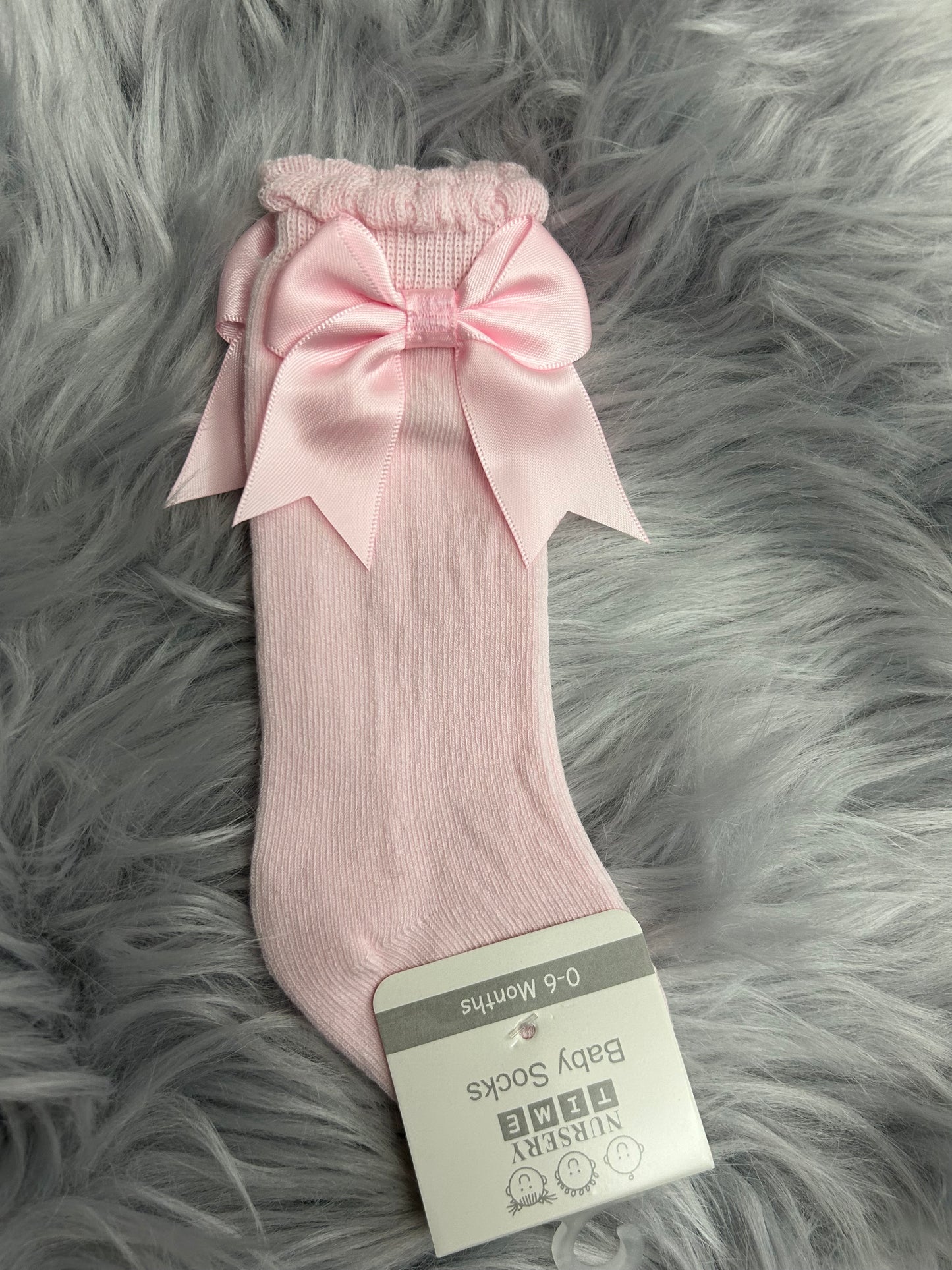 Knee high pink bow socks